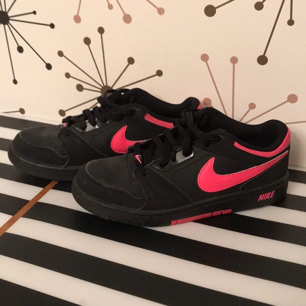 Black and hot pink Nike Dunks